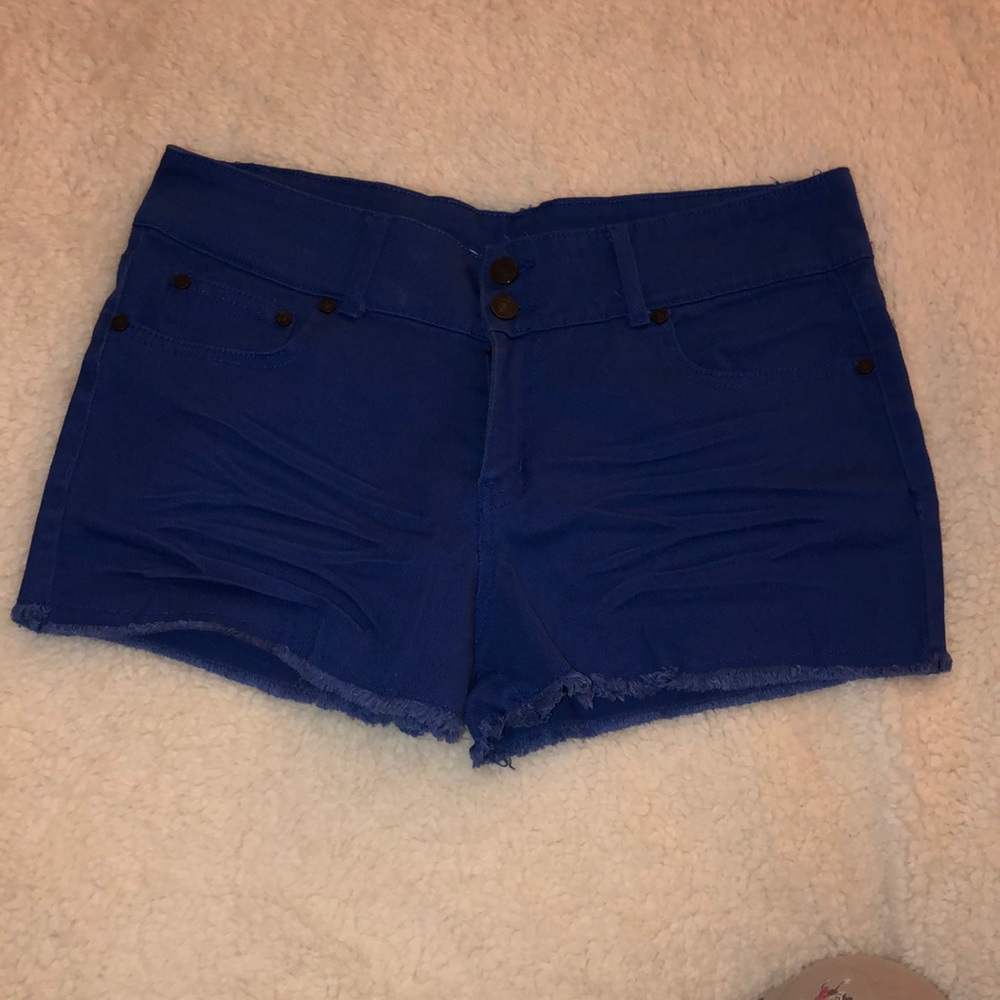 Royal blue distressed shorts.